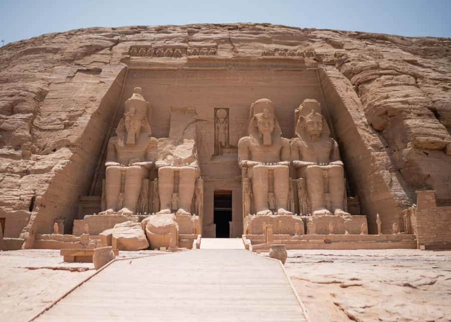 Aswan: Abu Simbel Group Tour with Guide and Entrance Fees - Great Temple of Ramses II: colossal faces and a relocation lesson